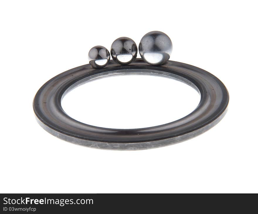 Bearing part of the round in a ring with three balls, isolated on white background. Bearing part of the round in a ring with three balls, isolated on white background.