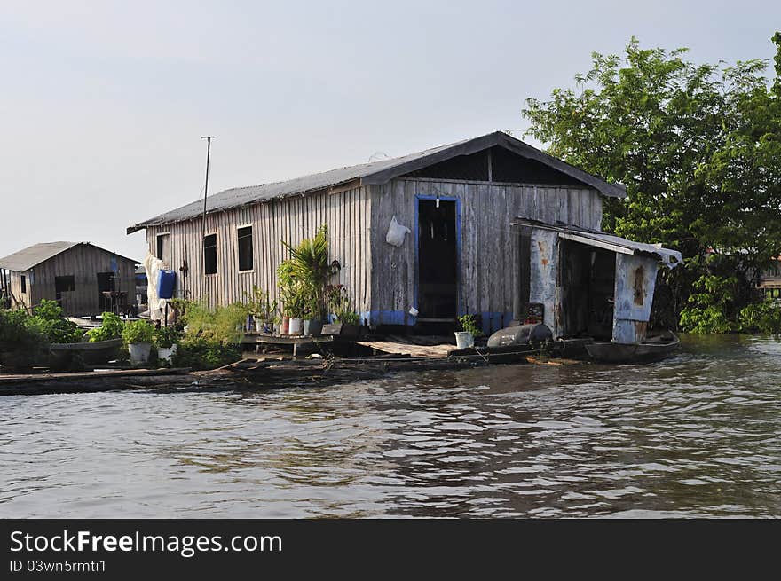 A typical stilt house of the nastiva amazon people.  Iranduba region, Amazonas river, Brazil. A typical stilt house of the nastiva amazon people.  Iranduba region, Amazonas river, Brazil.