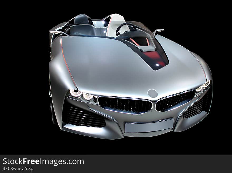 Luxury sport car silver colour isolated on black background. Luxury sport car silver colour isolated on black background