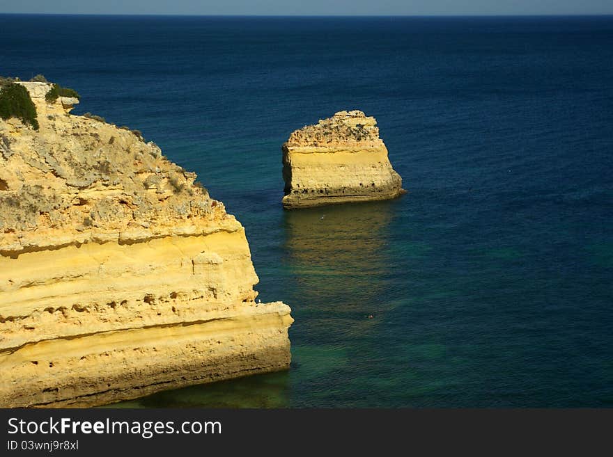 The rocky shoreline of Carvoeiro, Algarve. The rocky shoreline of Carvoeiro, Algarve