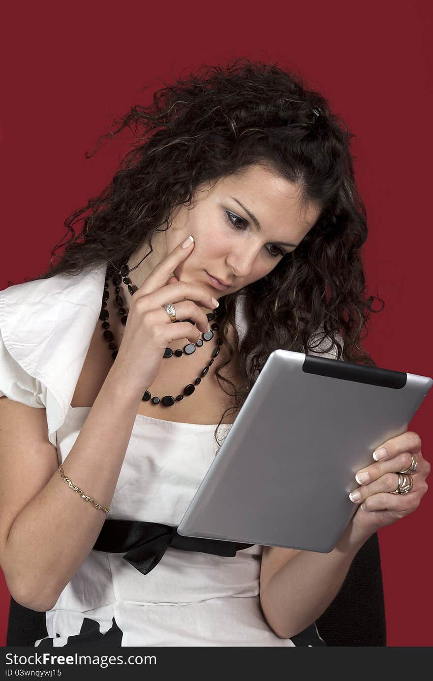 Girl working with the portable tablet computer. Girl working with the portable tablet computer