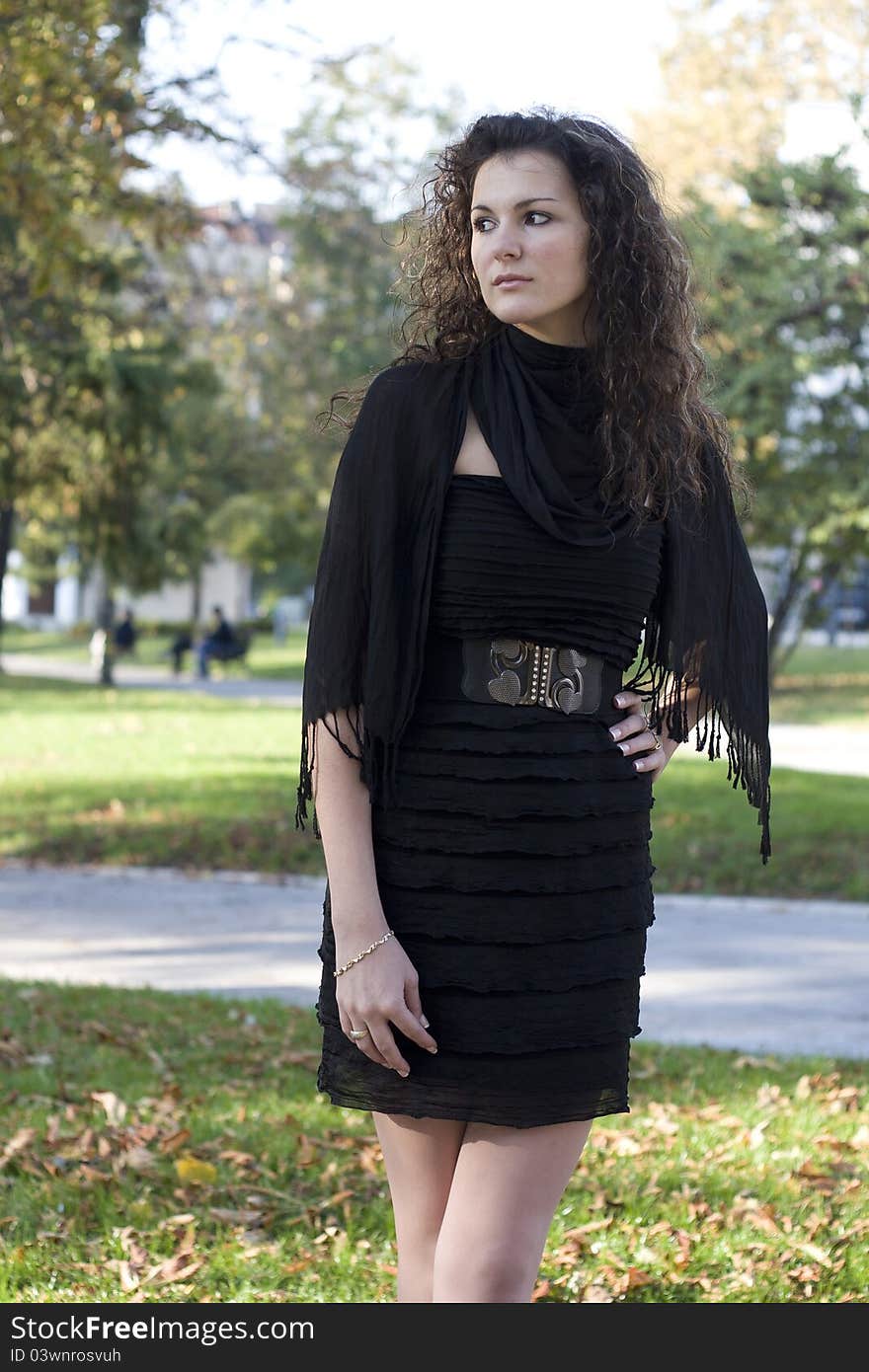 Autumn in Serbia and a young woman who stands in the park and waiting. Autumn in Serbia and a young woman who stands in the park and waiting