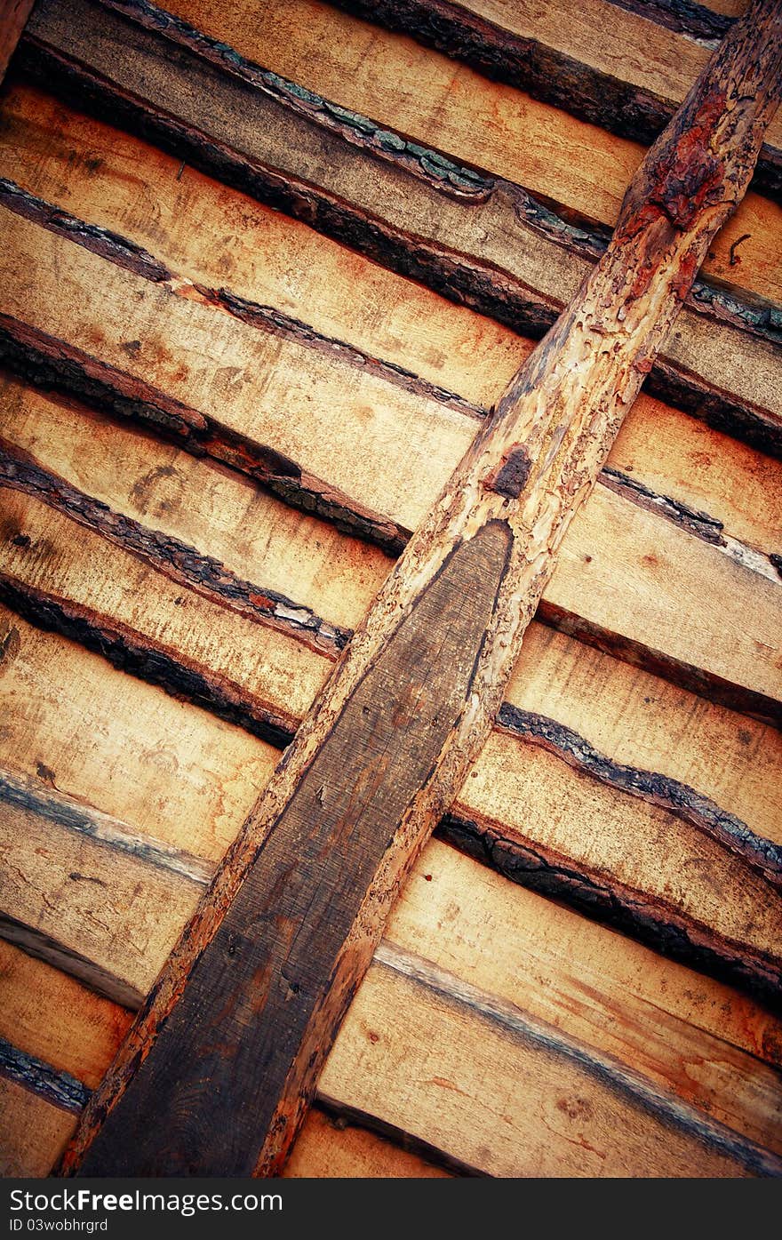 The sawn wooden boards. Wooden texture in grunge background. The sawn wooden boards. Wooden texture in grunge background