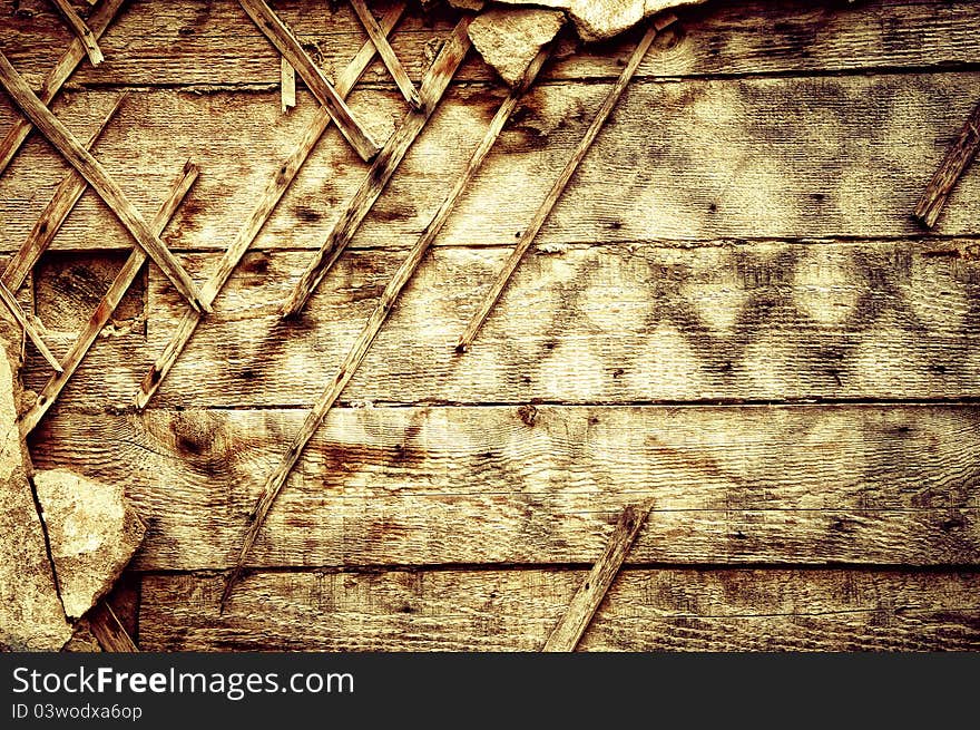 The destroyed old wall. Wooden texture in grunge background. The destroyed old wall. Wooden texture in grunge background