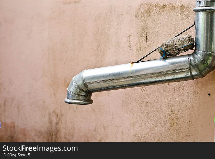 Old pipe with grunge background