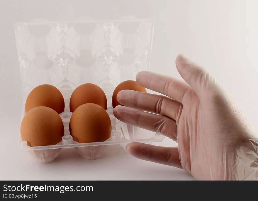 Hand of man points to chicken eggs. Hand of man points to chicken eggs.