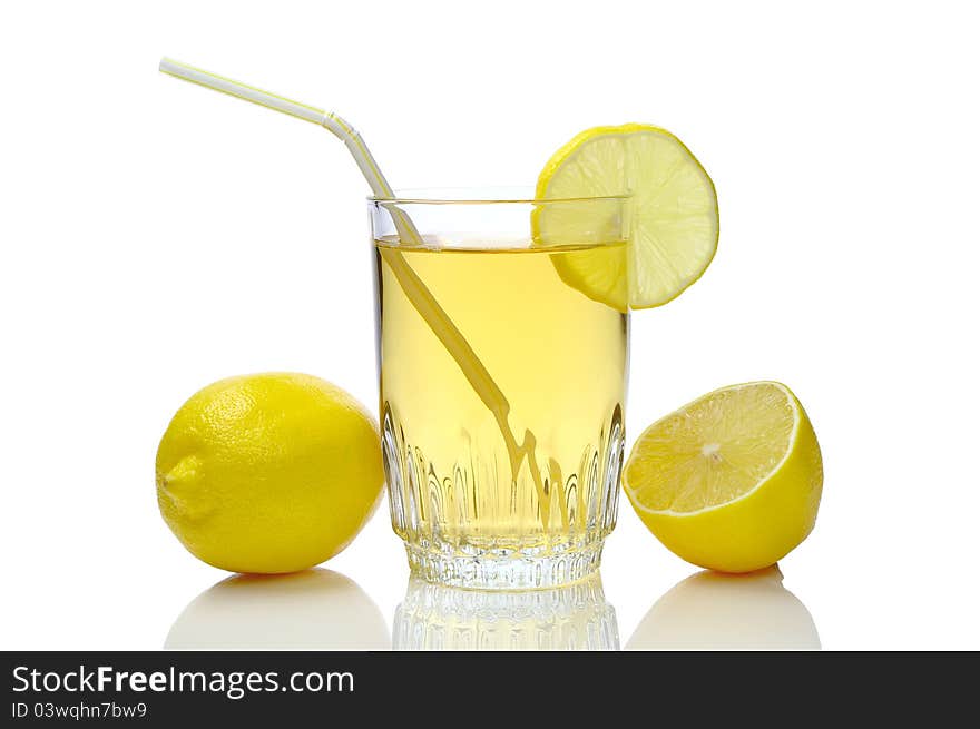 Glass of juice and lemons on a white background