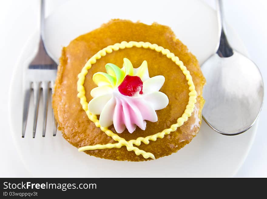 Closeup Cup cake and fork on white background