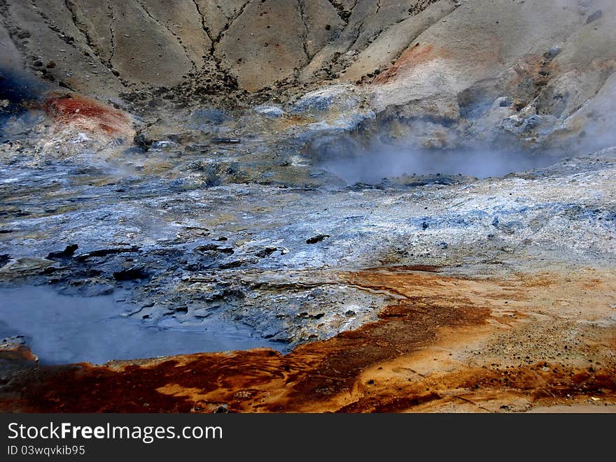 Gorgeous colors of earth and stone surrounding geysers in Iceland. Gorgeous colors of earth and stone surrounding geysers in Iceland