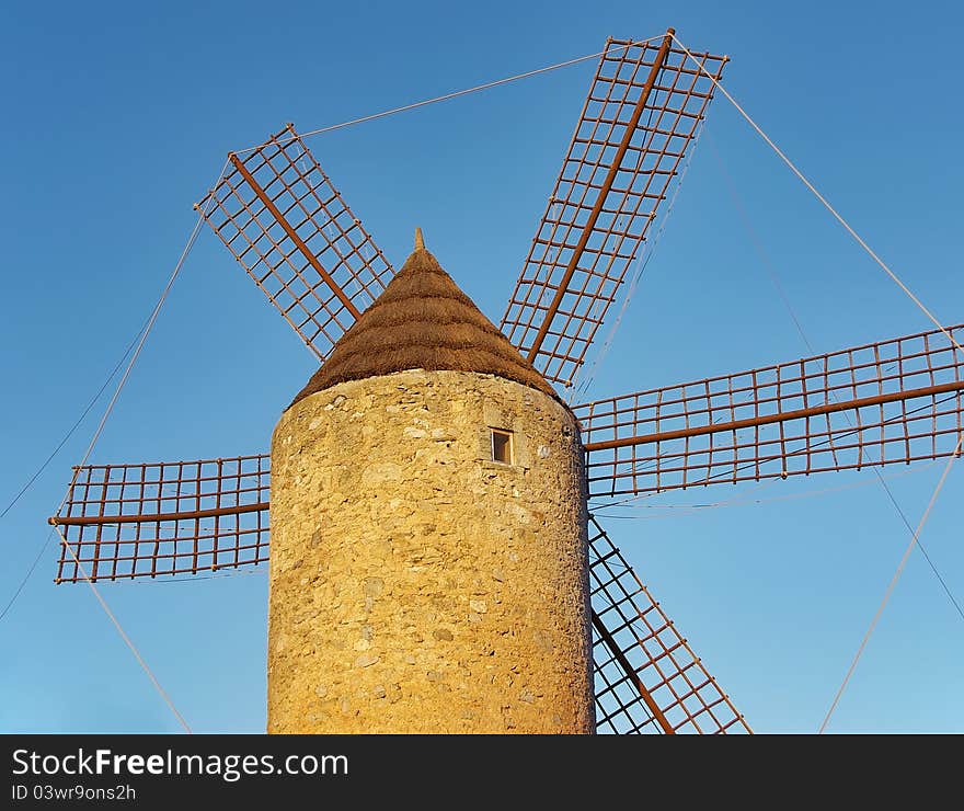 Old windmill in a farm of Majorca (Spain). Old windmill in a farm of Majorca (Spain)