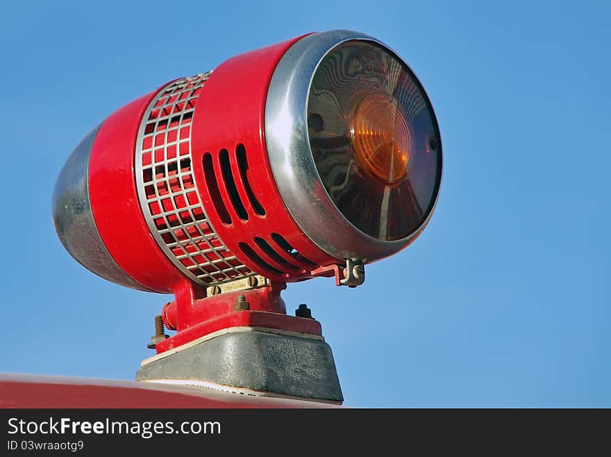 Detail of a Red siren over a firefighters vehicle