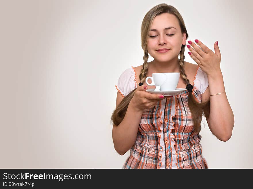 Beautiful woman drinking a cup of tea  in the morning