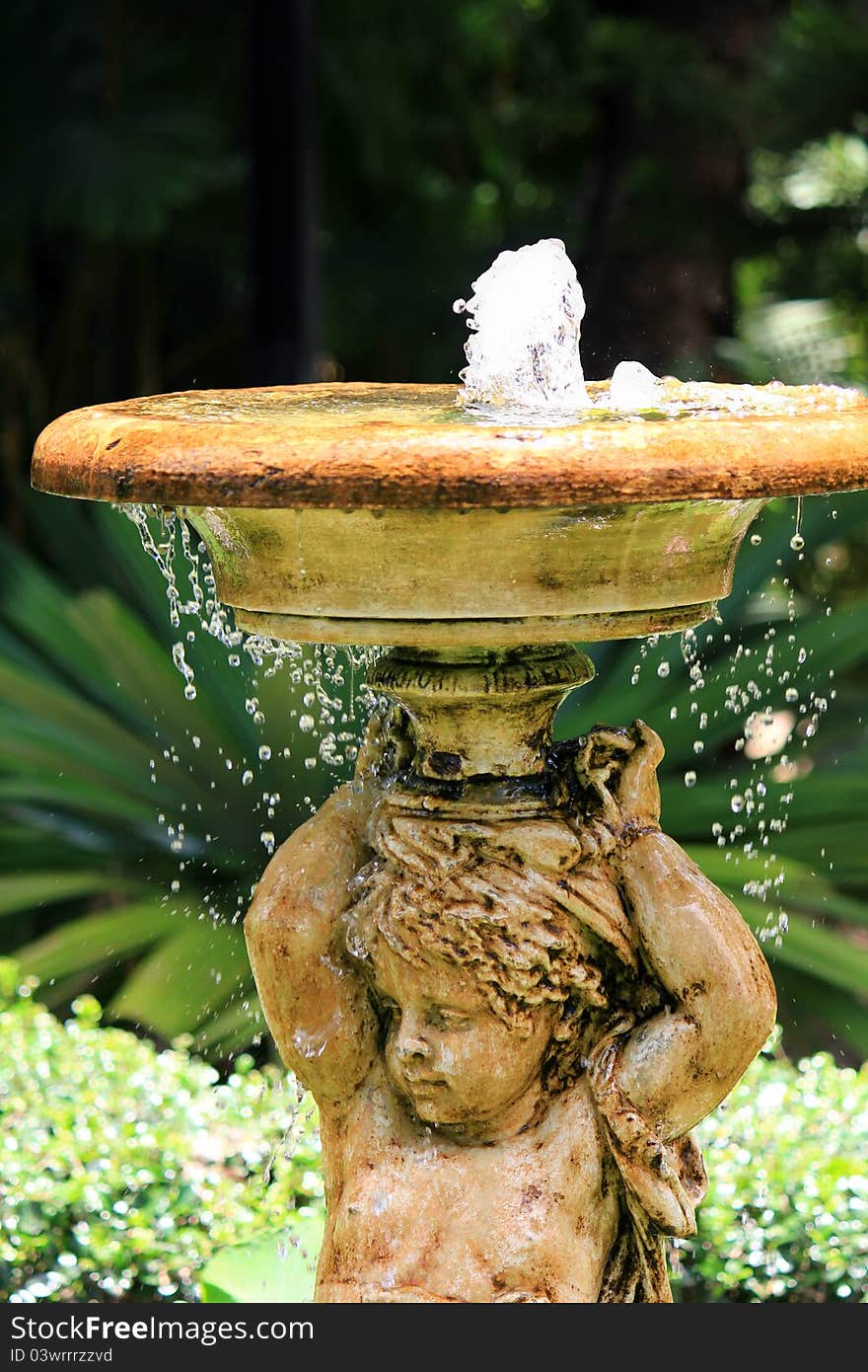 Bubbling Angel Sculpture Fountain in the garden