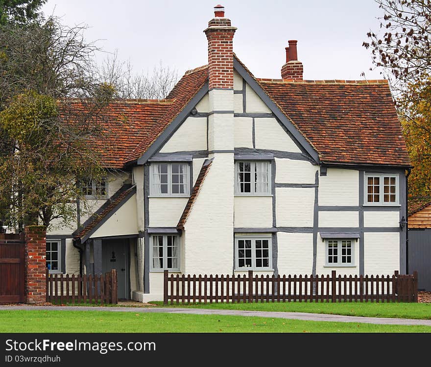 Traditional Timber Framed English Village Cottage with picket fence