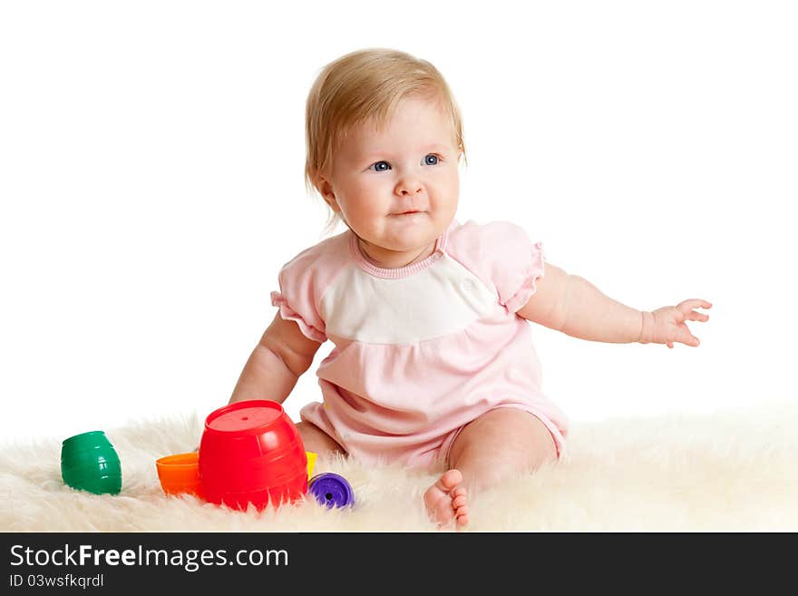 Child Is Playing With Toys While Sitting On Floor