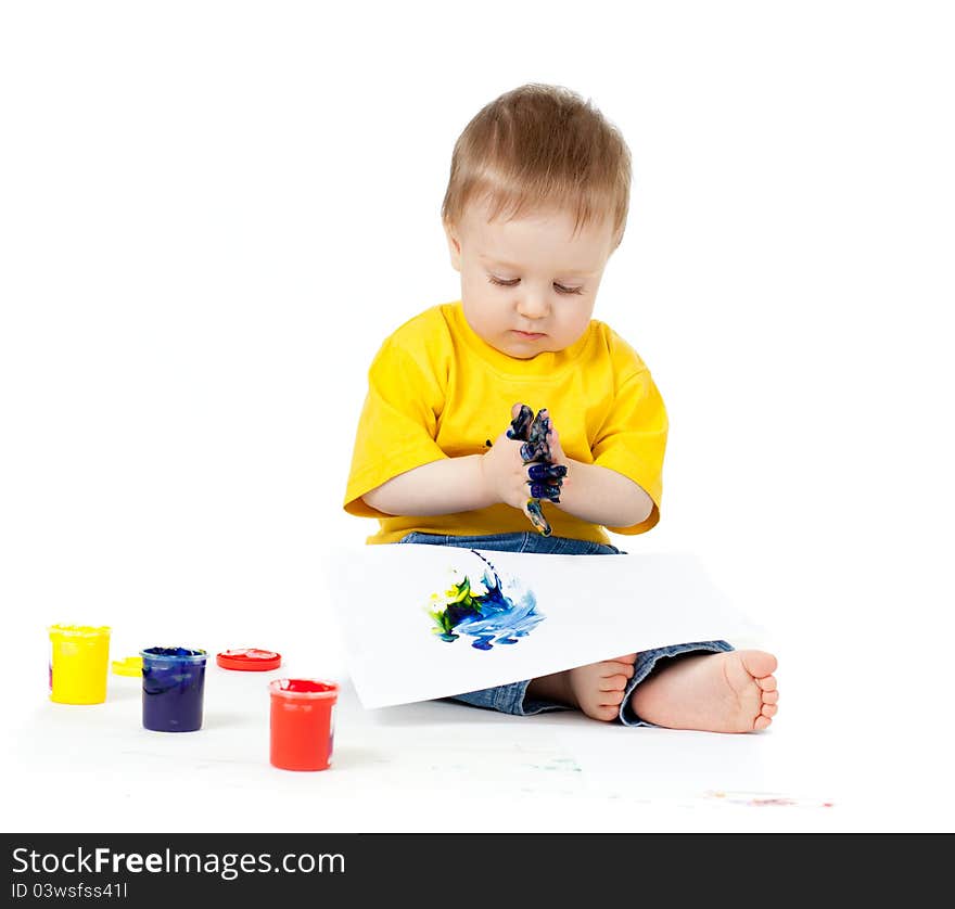 Adorable dirty child boy with paints