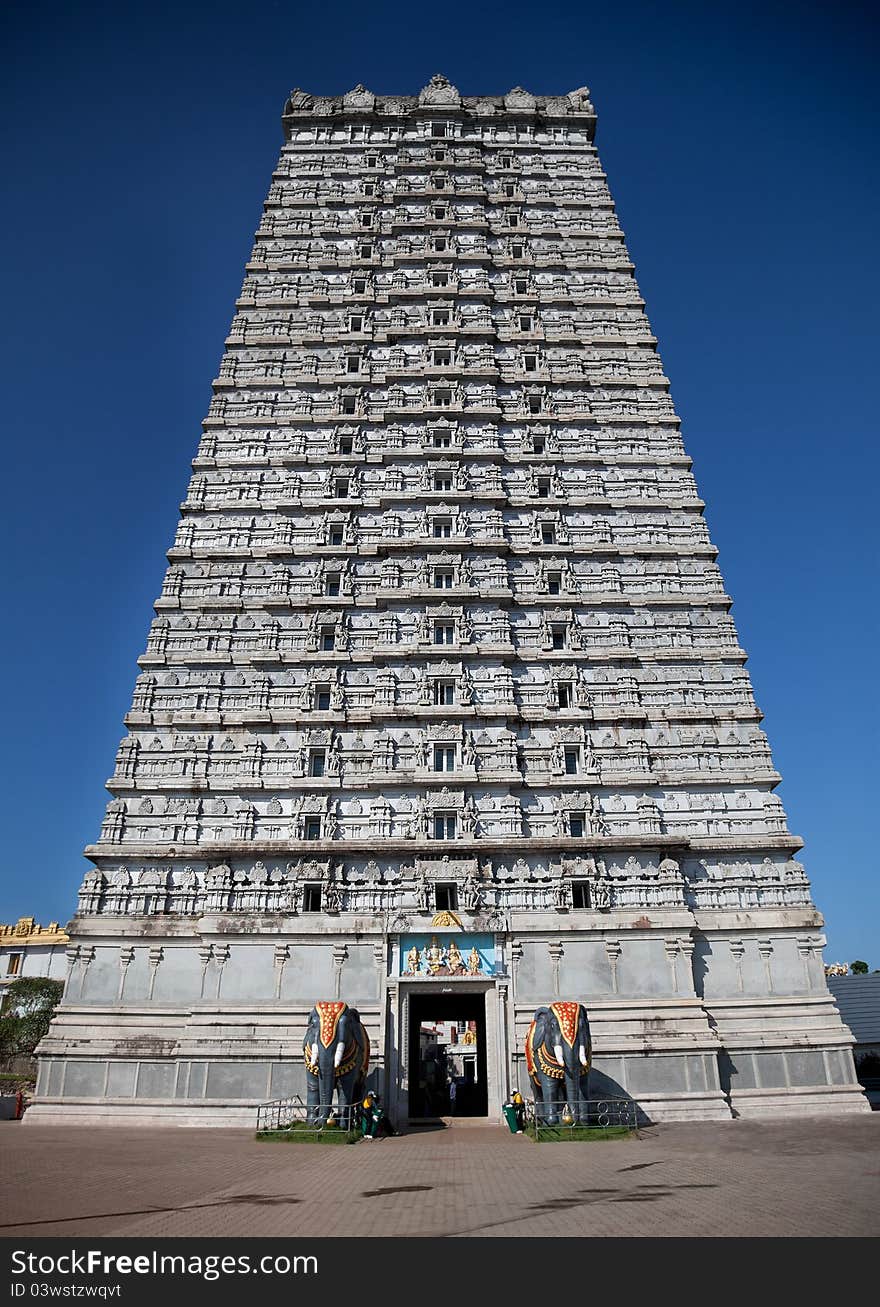 Detail of South Indian temple architecture -Gopuram or Gopura, is a monumental tower, usually ornate, at the entrance of any temple, especially in Southern India South Indian temple architecture. Murudeshwara -Karnataka. Detail of South Indian temple architecture -Gopuram or Gopura, is a monumental tower, usually ornate, at the entrance of any temple, especially in Southern India South Indian temple architecture. Murudeshwara -Karnataka