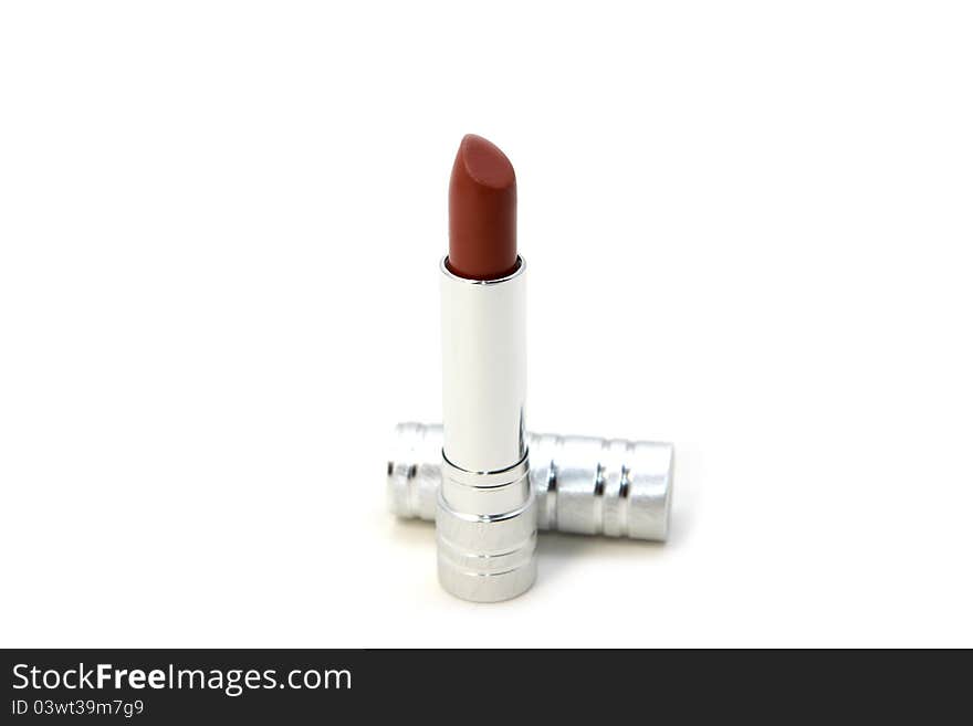 Red lipstick with silver corpus over white