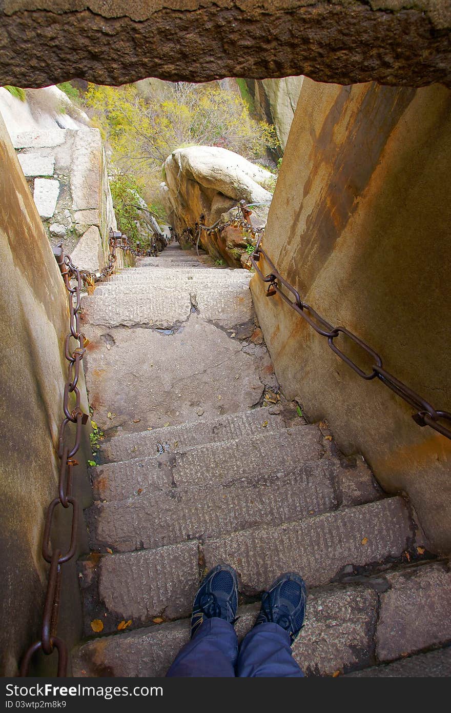 Mountain climbing dangerous road in Mount Hua(Huashan). Huashan is one of the most perilous tourist attractions in china. Huashan is located in Huayin, Shaanxi, China. Mountain climbing dangerous road in Mount Hua(Huashan). Huashan is one of the most perilous tourist attractions in china. Huashan is located in Huayin, Shaanxi, China.