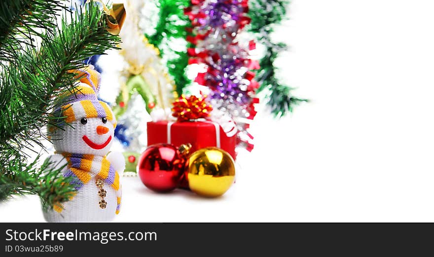 Snowman on the background of Christmas decorations