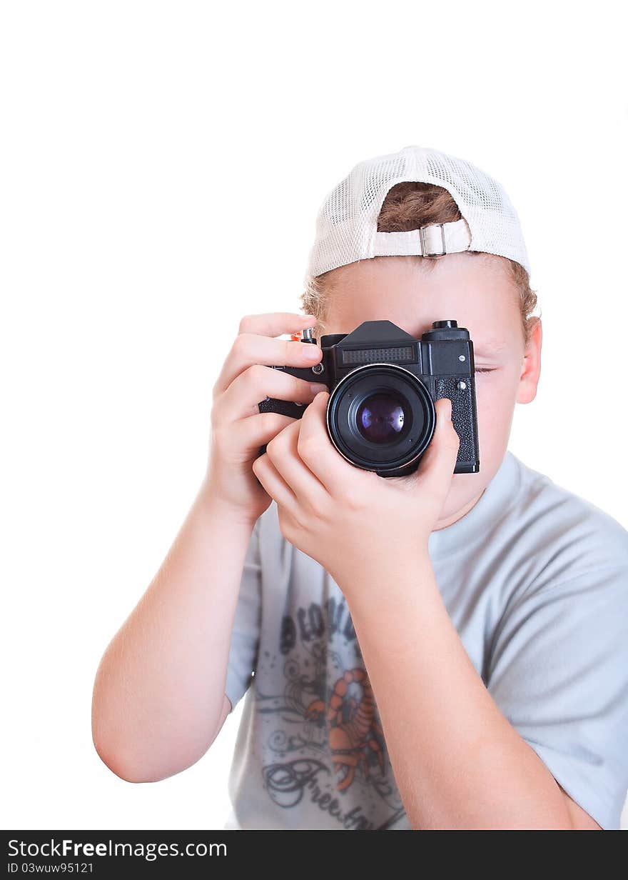 Boy with a camera on a white background. Boy with a camera on a white background