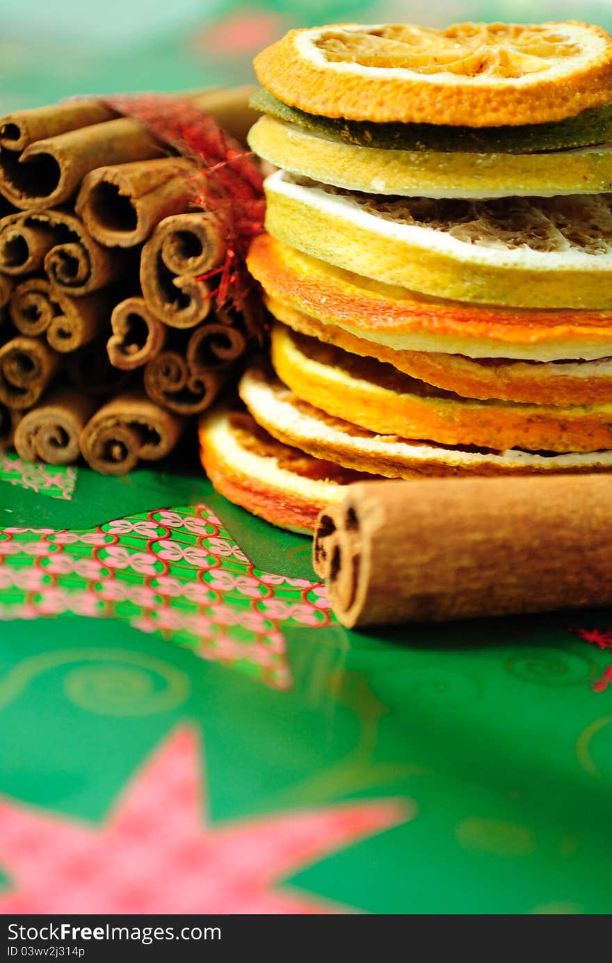 Cinnamon sticks and sliced of dried orange. christmas decoration. selective focus. Cinnamon sticks and sliced of dried orange. christmas decoration. selective focus