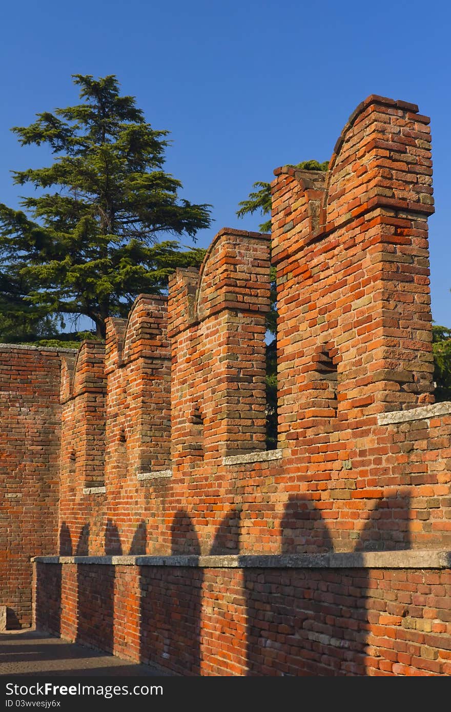 Detailed view of a old brick bridge in Verona over Adige river - Castelvecchio, Italy. Detailed view of a old brick bridge in Verona over Adige river - Castelvecchio, Italy