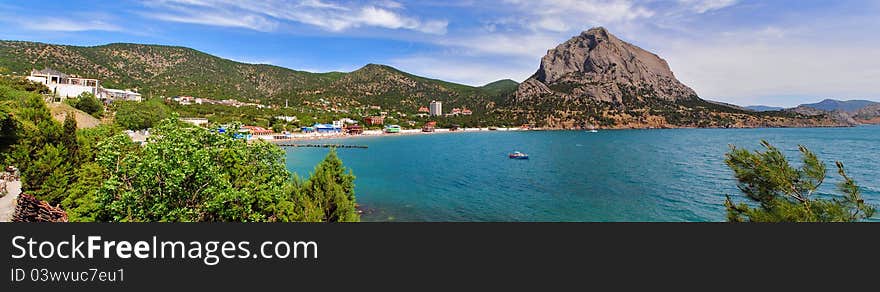 Panorama of the summer beach int he mountains. Panorama of the summer beach int he mountains