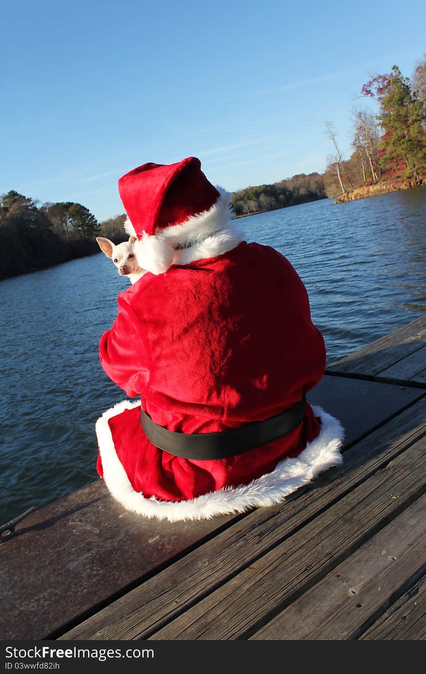 Santa On The Dock With His Dog