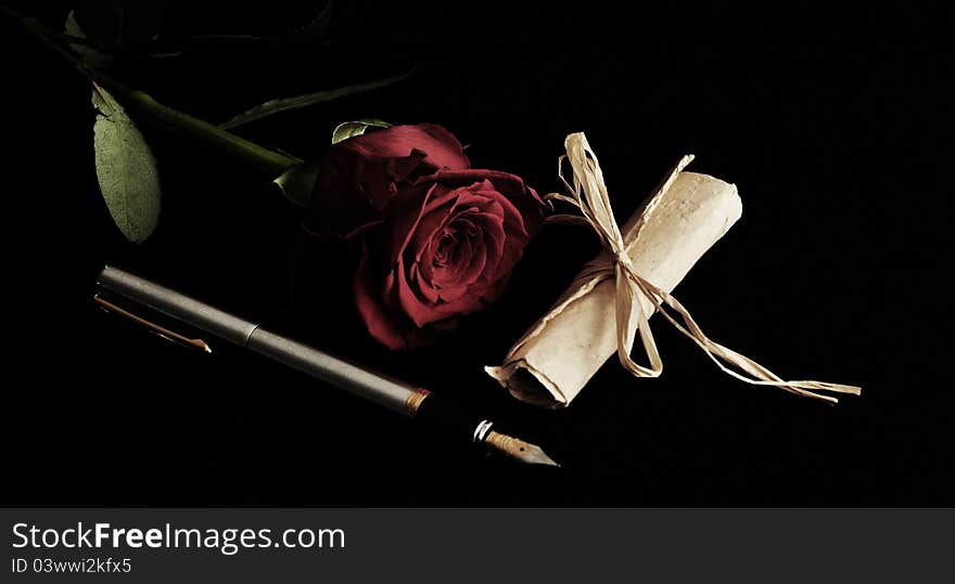 Fountain pen and red rose with parchment. Fountain pen and red rose with parchment