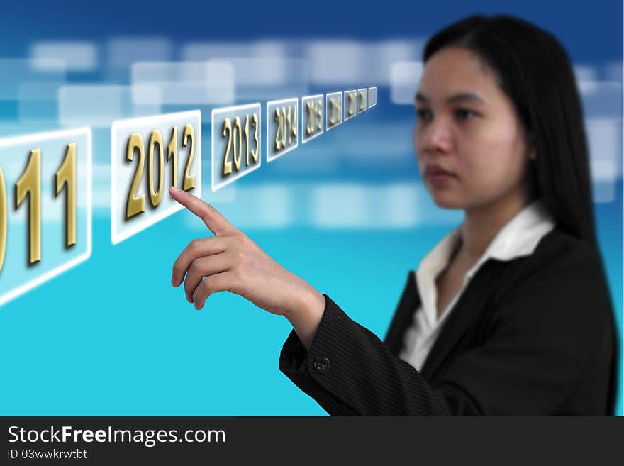 Business woman point to Year 2012 on touch screen interface