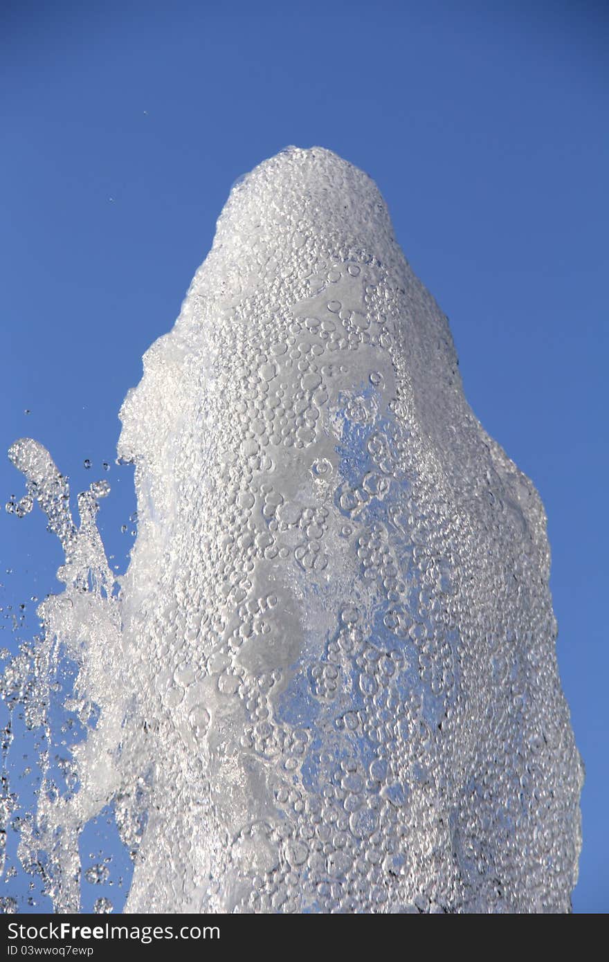 Freeze water fountain on blue sky. Freeze water fountain on blue sky