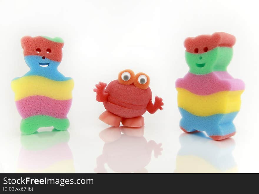 Full Color sponge for children in the form of bears and a brush frog made of natural materials on white background. Full Color sponge for children in the form of bears and a brush frog made of natural materials on white background.