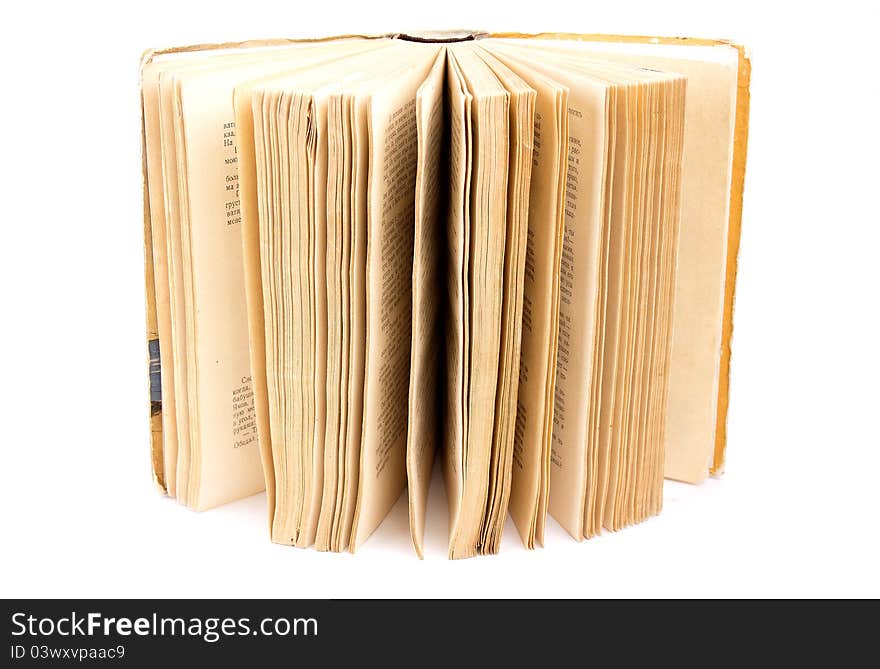 Open old book on white background isolated