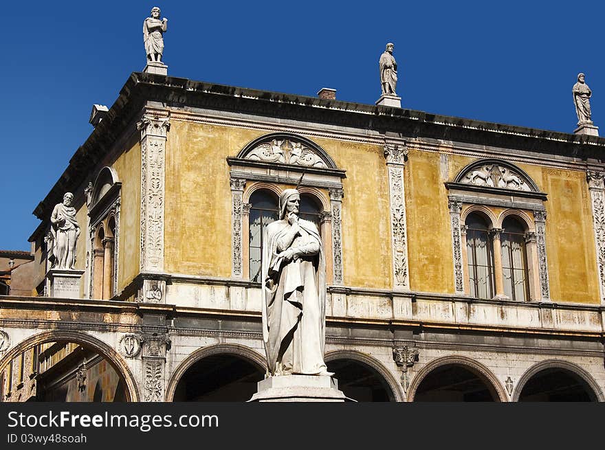 Photo of Dante square in Verone, in the foreground with the white statue of Dante Alighieri. Photo of Dante square in Verone, in the foreground with the white statue of Dante Alighieri