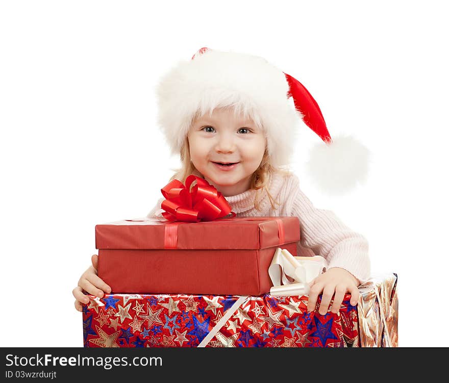 Happy child in Christmas Santa's hats with gift boxes