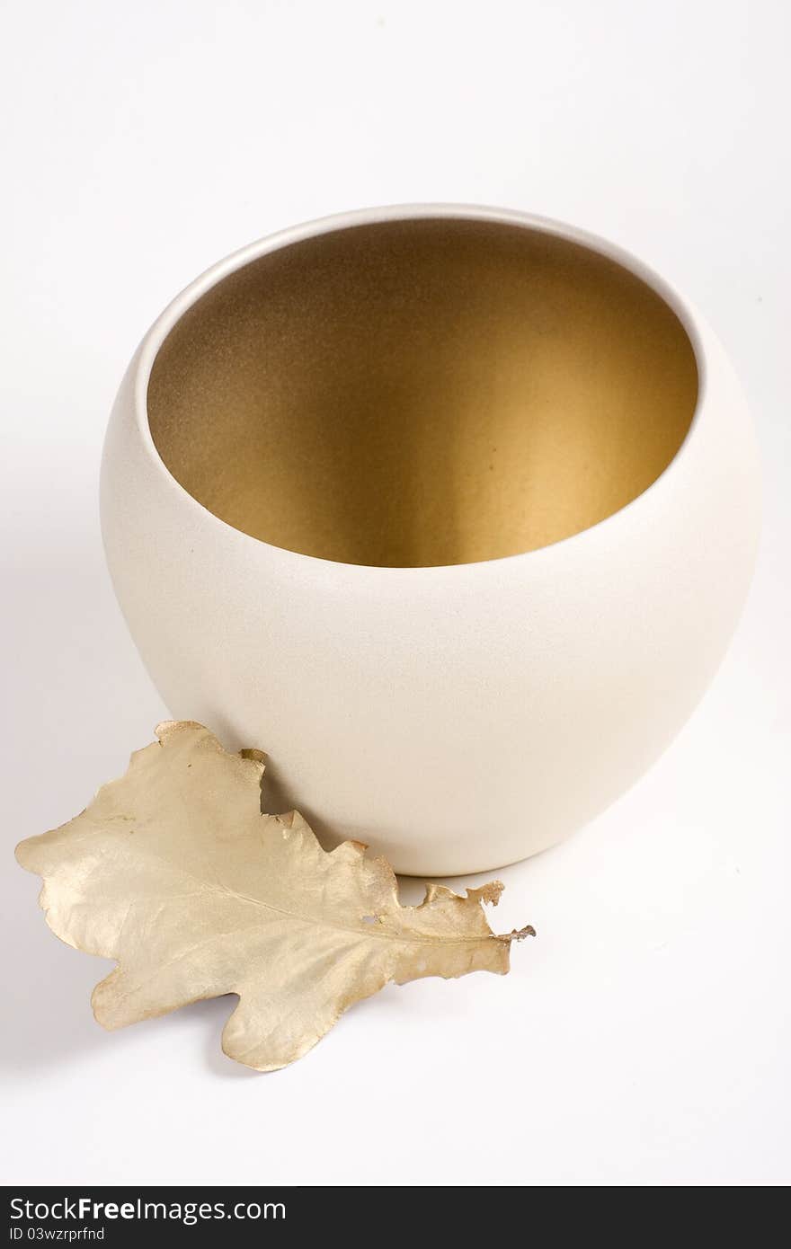 Golden leaf and vase