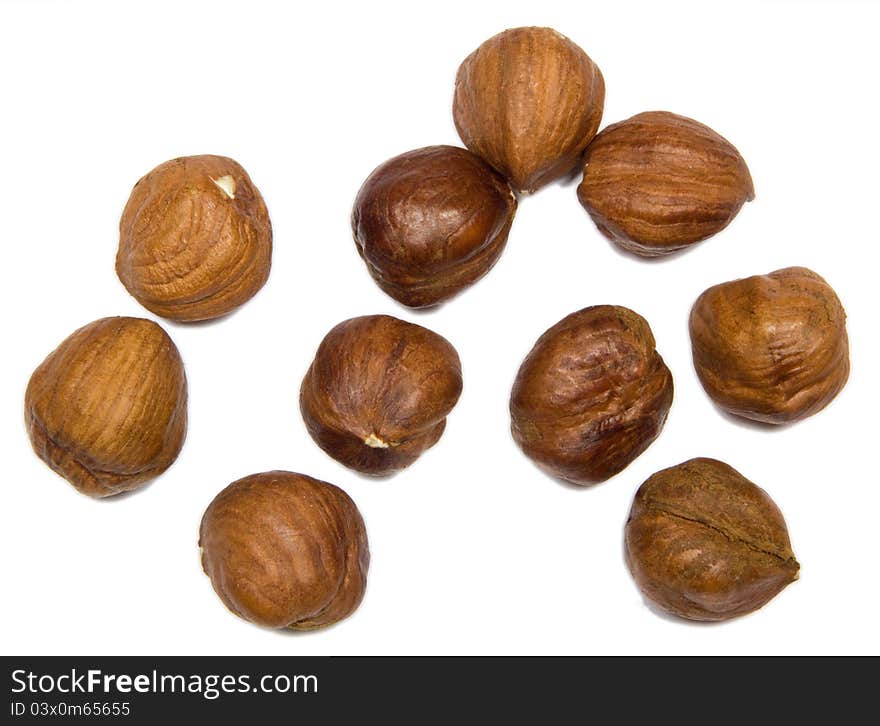 Close up open hazelnuts isolated on white background.