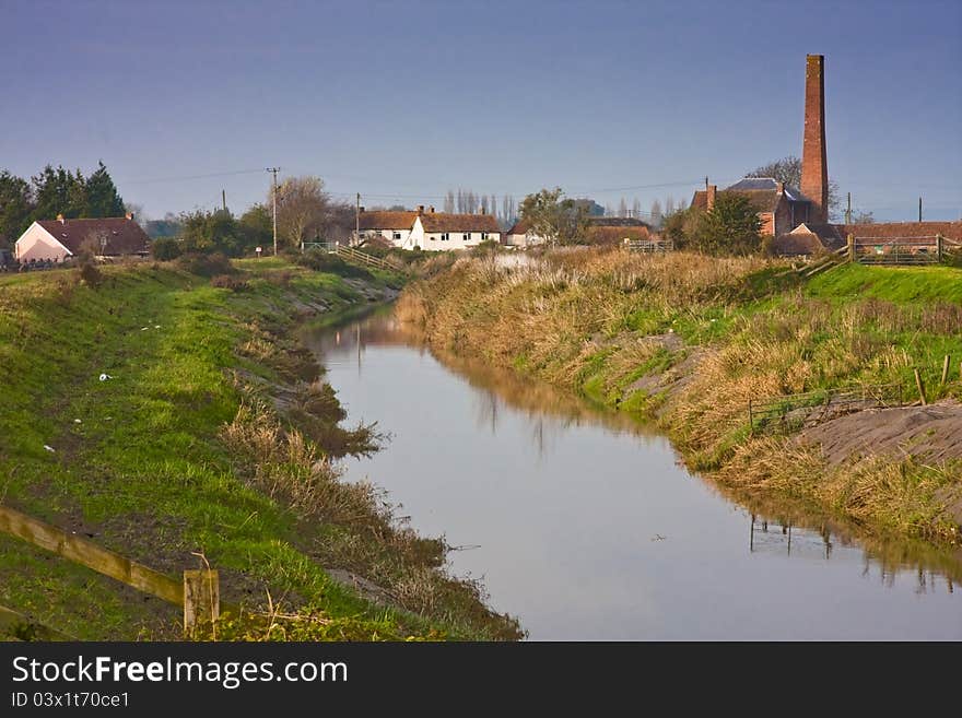 Farming community by tidal river