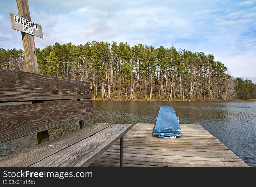 A bench and diving board sit unused until next summer. A bench and diving board sit unused until next summer.