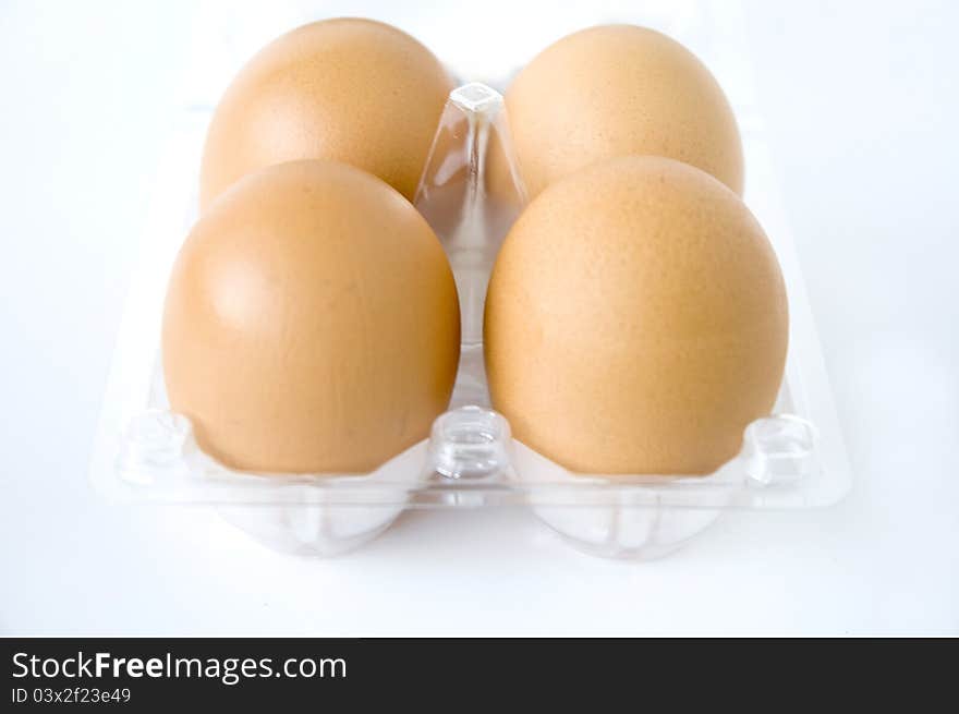 Eggs in clear pack on white background