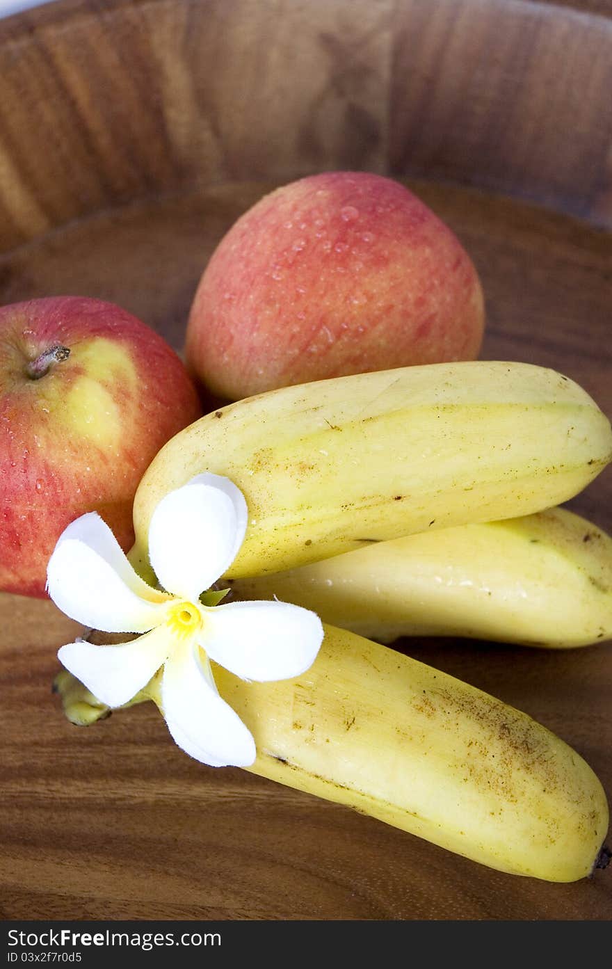 Fresh apples and banana on wooden tray. Fresh apples and banana on wooden tray