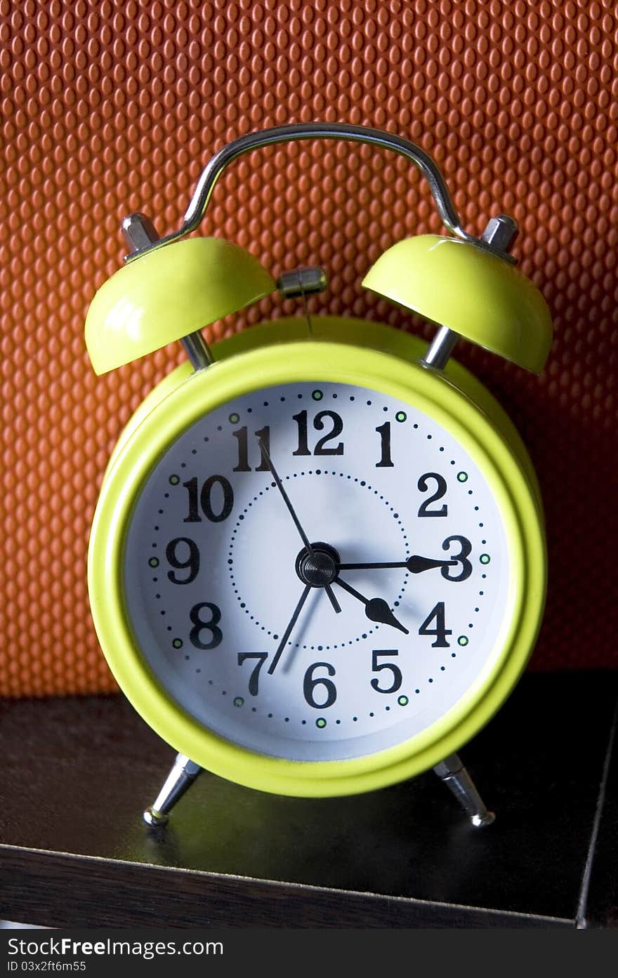 Light green color alarm clock with color background. Light green color alarm clock with color background