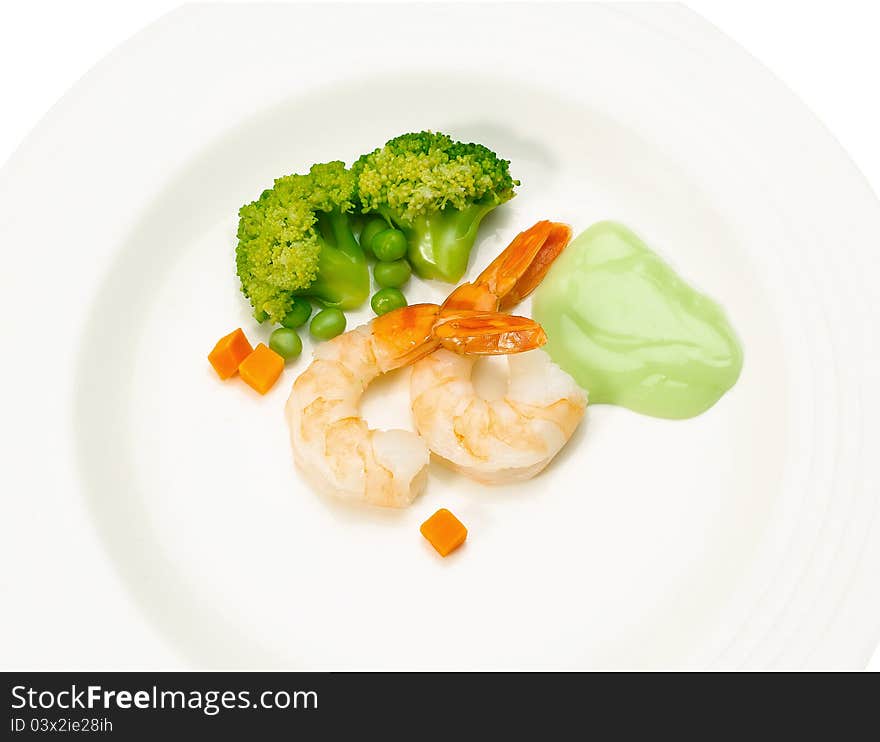 Clean and great taste of shrimps seafood menu display on dish with gravy broccoli and green pea. Clean and great taste of shrimps seafood menu display on dish with gravy broccoli and green pea