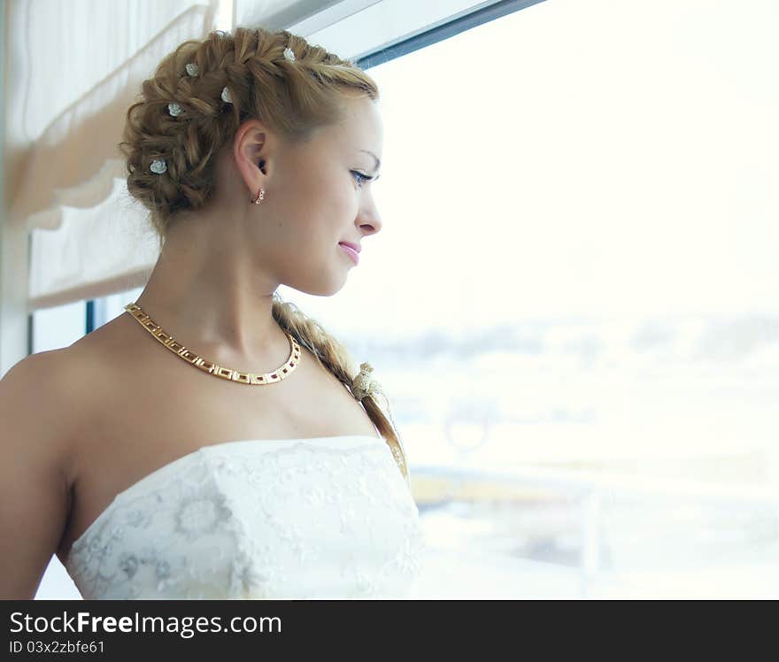 Portrait of young girl in the wedding dress. Portrait of young girl in the wedding dress.