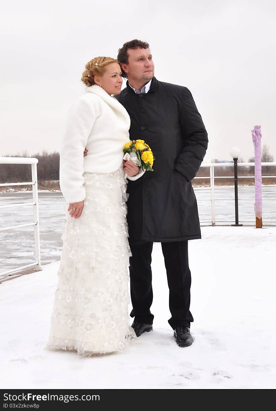 Winter portrait of fiance and bride.