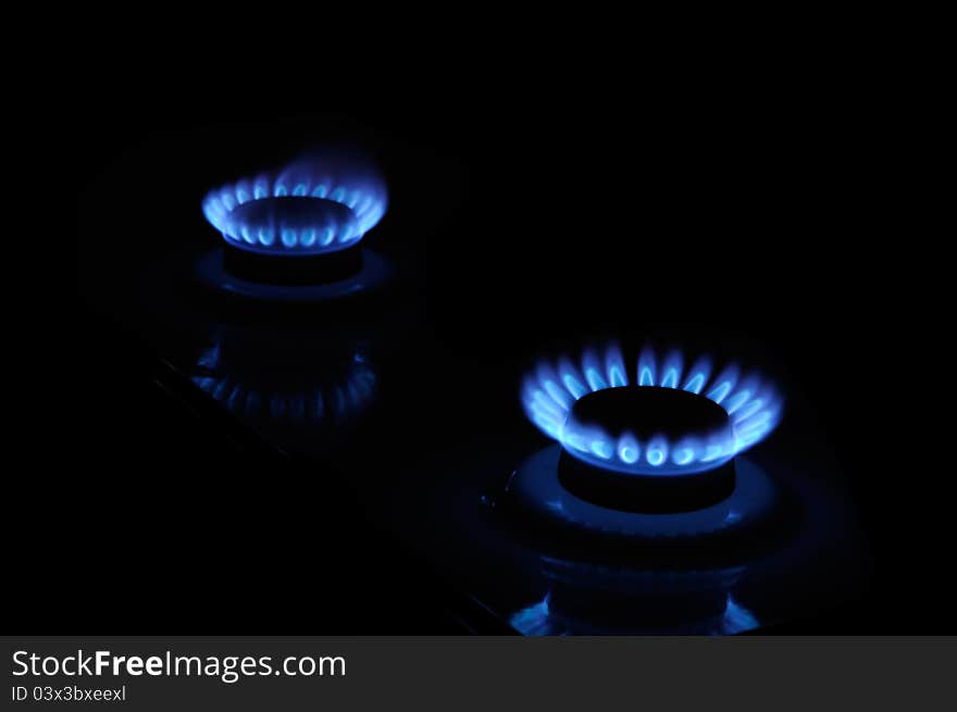 Blue Flames of Gas in the Dark