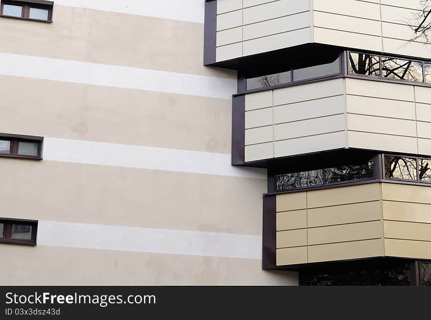 The facade of a modern building with balconies. The facade of a modern building with balconies