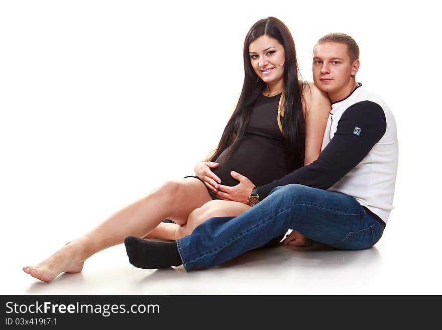 Portrait of happy pregnant women with husband on white background. Portrait of happy pregnant women with husband on white background