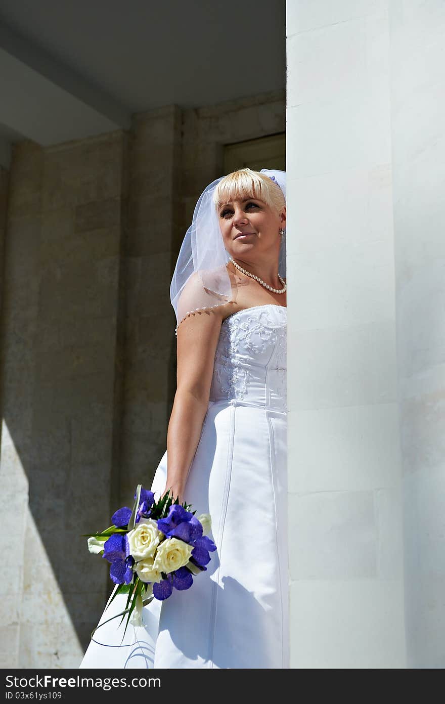 Happy Bride Near White Columns